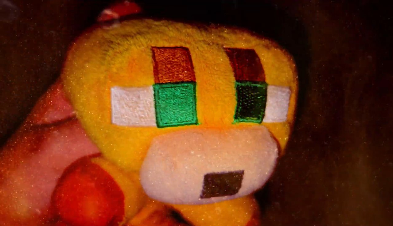 Yellow plush character in warm light