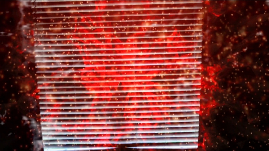 Red glowing gate behind window blinds