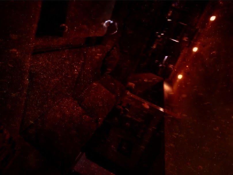 A dark machine room still from The Breach